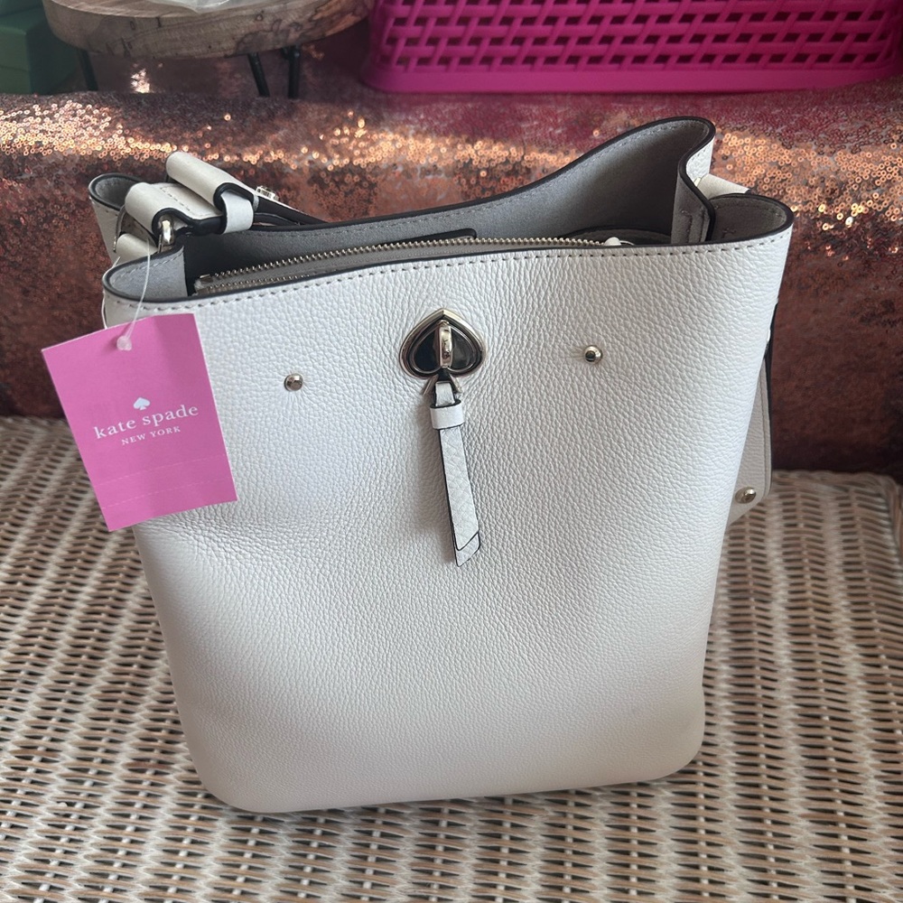 Kate Spade New York Marti large bucket bag in white pebbled leather.